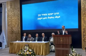 THE WRITER addresses the Iftar gathering as President Isaac Herzog (center) and Michal Herzog listen(photo credit: Yonadav Homik)